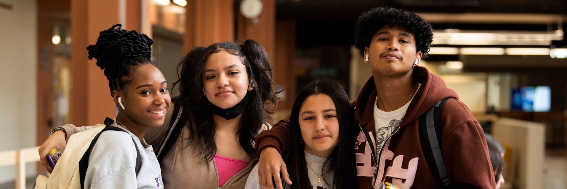 image of four acc students smiling at the camera