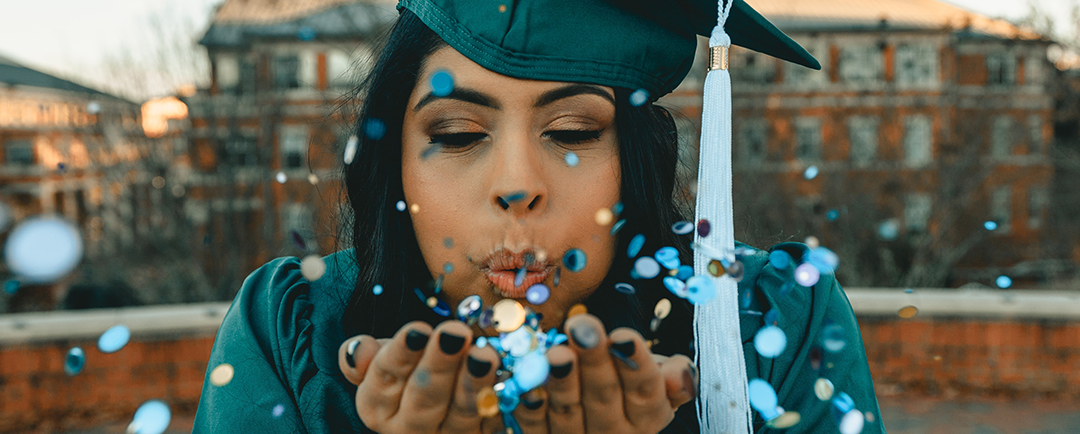 female graduate in cap and gown