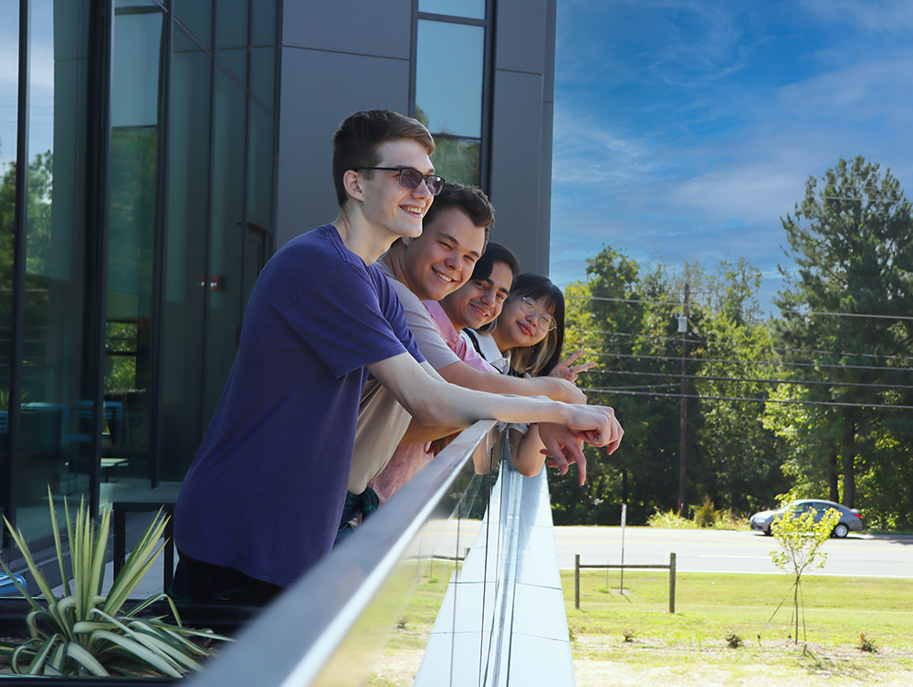 students standing together at the biotechnology building